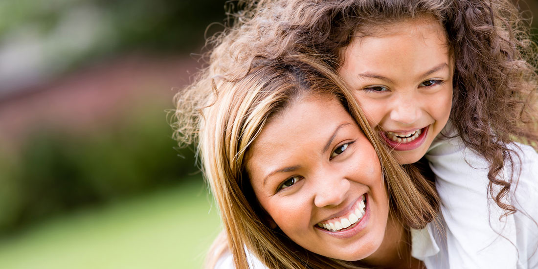 Mom and Daughter Smiling Dental Sealants