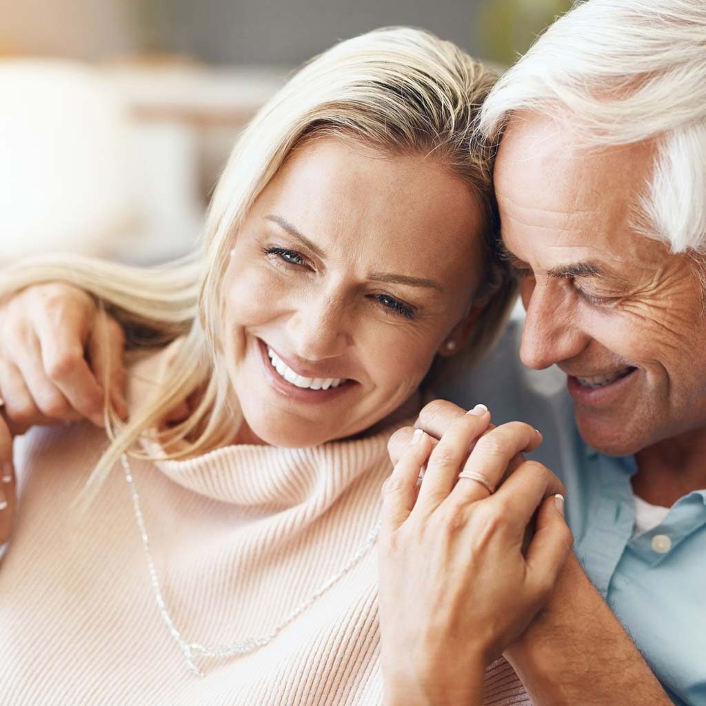 Older Smiling Couple with Full Mouth Dental Implants